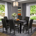 Ensemble de salle à manger HomeStock Belmont, 7 pièces : table rectangulaire de 60 pouces et six chaises Parson avec pieds noirs et revêtement en cuir PU noir