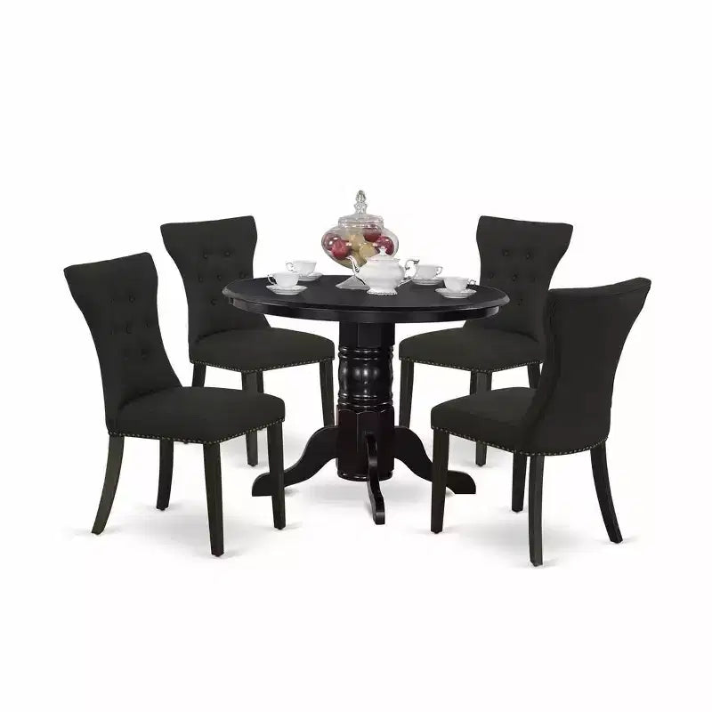 Ensemble de salle à manger HomeStock 5 pièces avec table ronde plateau en bois massif finition noire et 4 chaises rembourrées