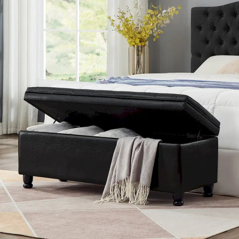Banc de rangement capitonné noir avec revêtement en similicuir et pieds en bois tournés, Banc Ottoman de rangement